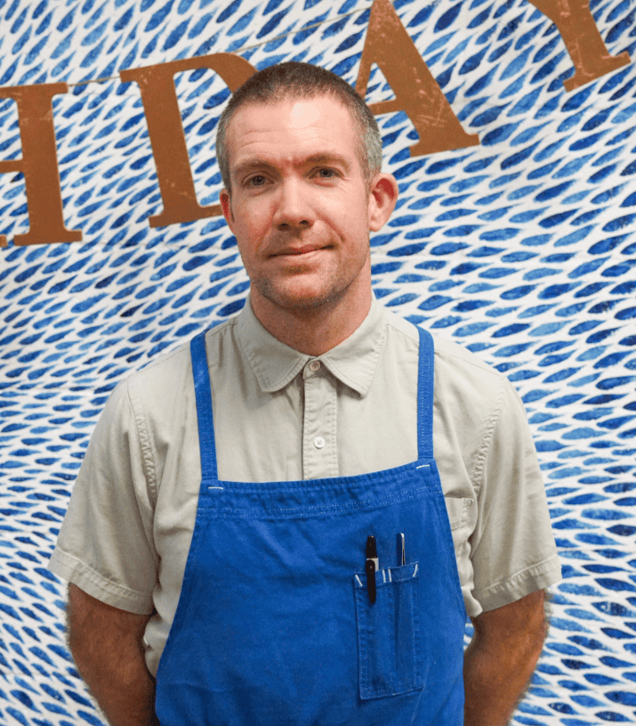 Chef de Cuisine smiling in his Birdie G's apron