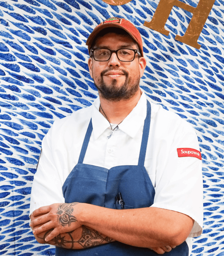 Sous Chef smiling in his Birdie G's apron and hat